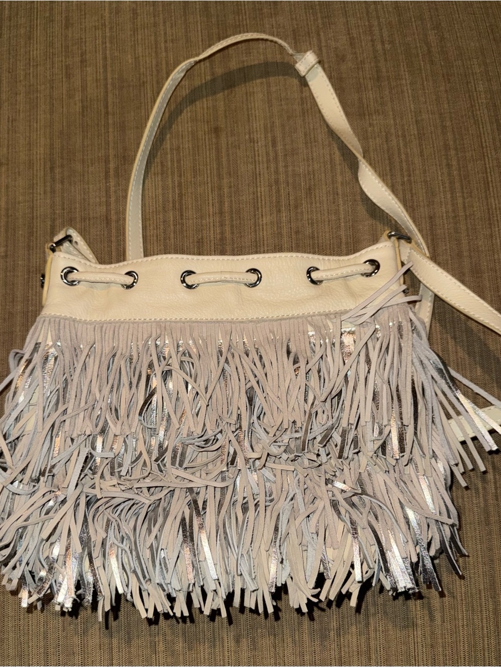 Sam Edelman Fringed cross body Bag in cream and silver. Drawstring close. NWOT